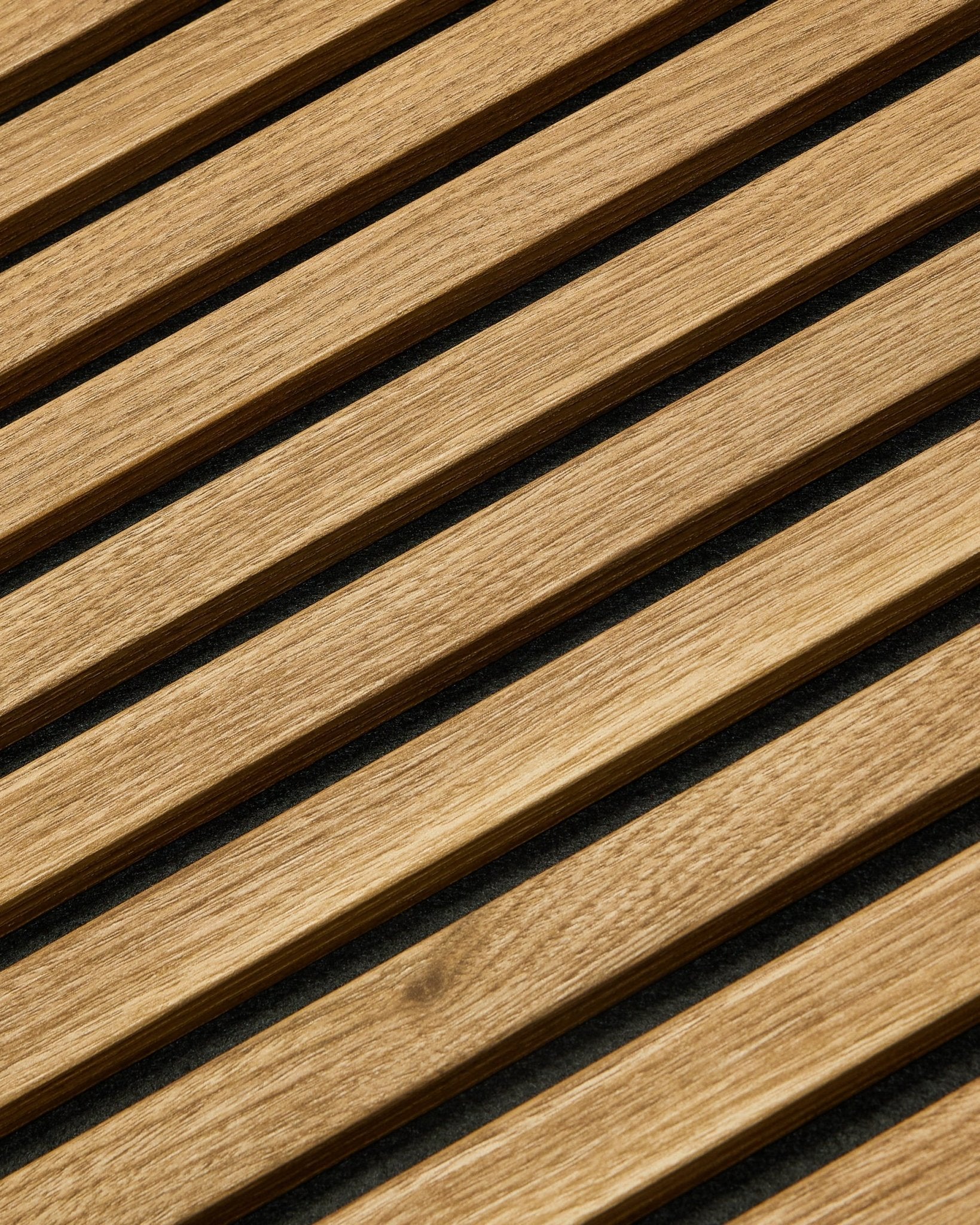 Essential Akupanel acoustic panel in English Oak by WoodUpp, 240 x 60 cm, featuring evenly spaced diagonal slats on a dark background.